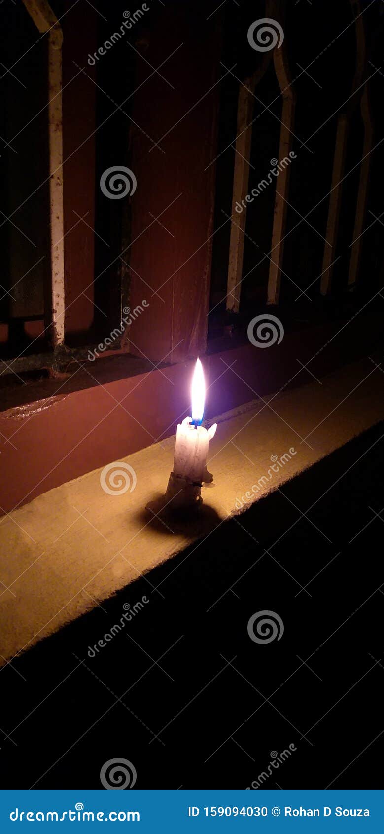 Bright White Candle Lit Besides the Window, Stock Photo Image of