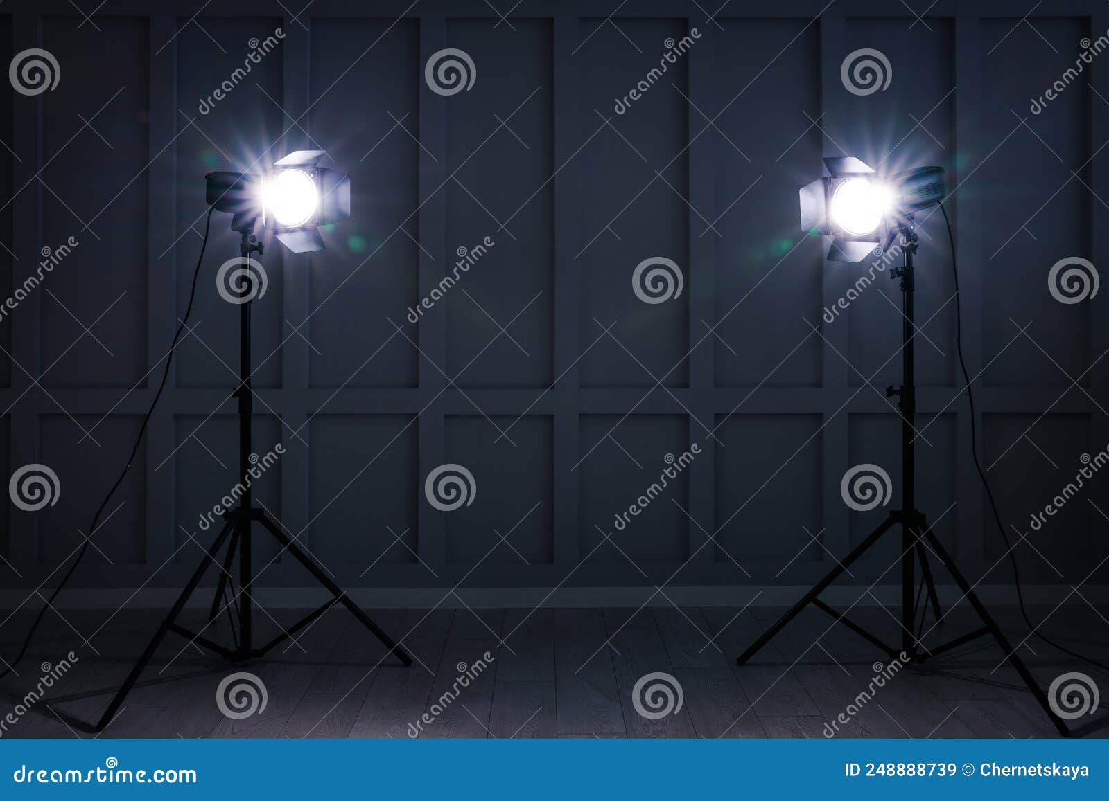Bright White Spotlights Near Wall Indoors, Space for Text Stock Image