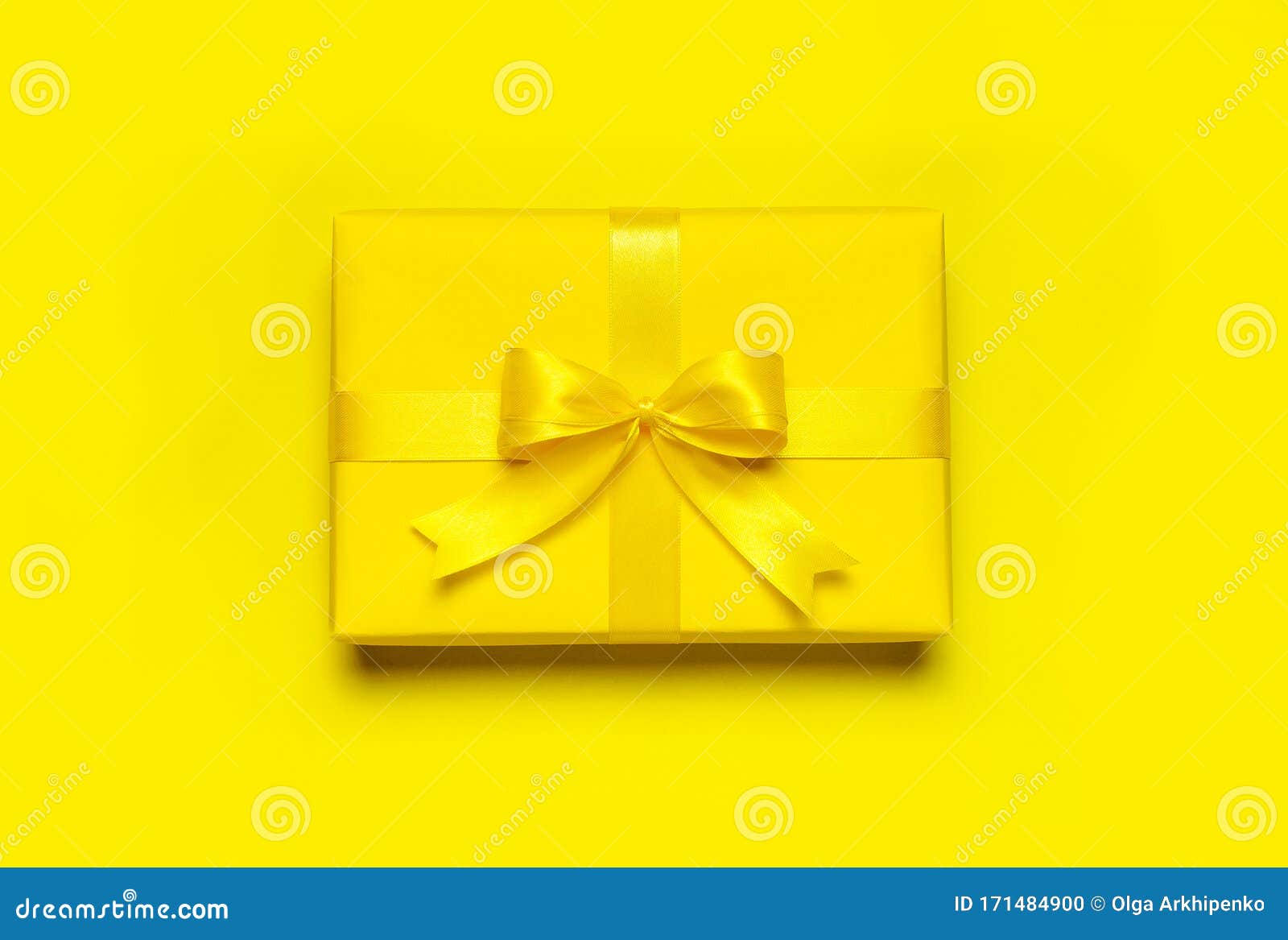 Bright Yellow Gift Present Box With Ribbon And Bow On