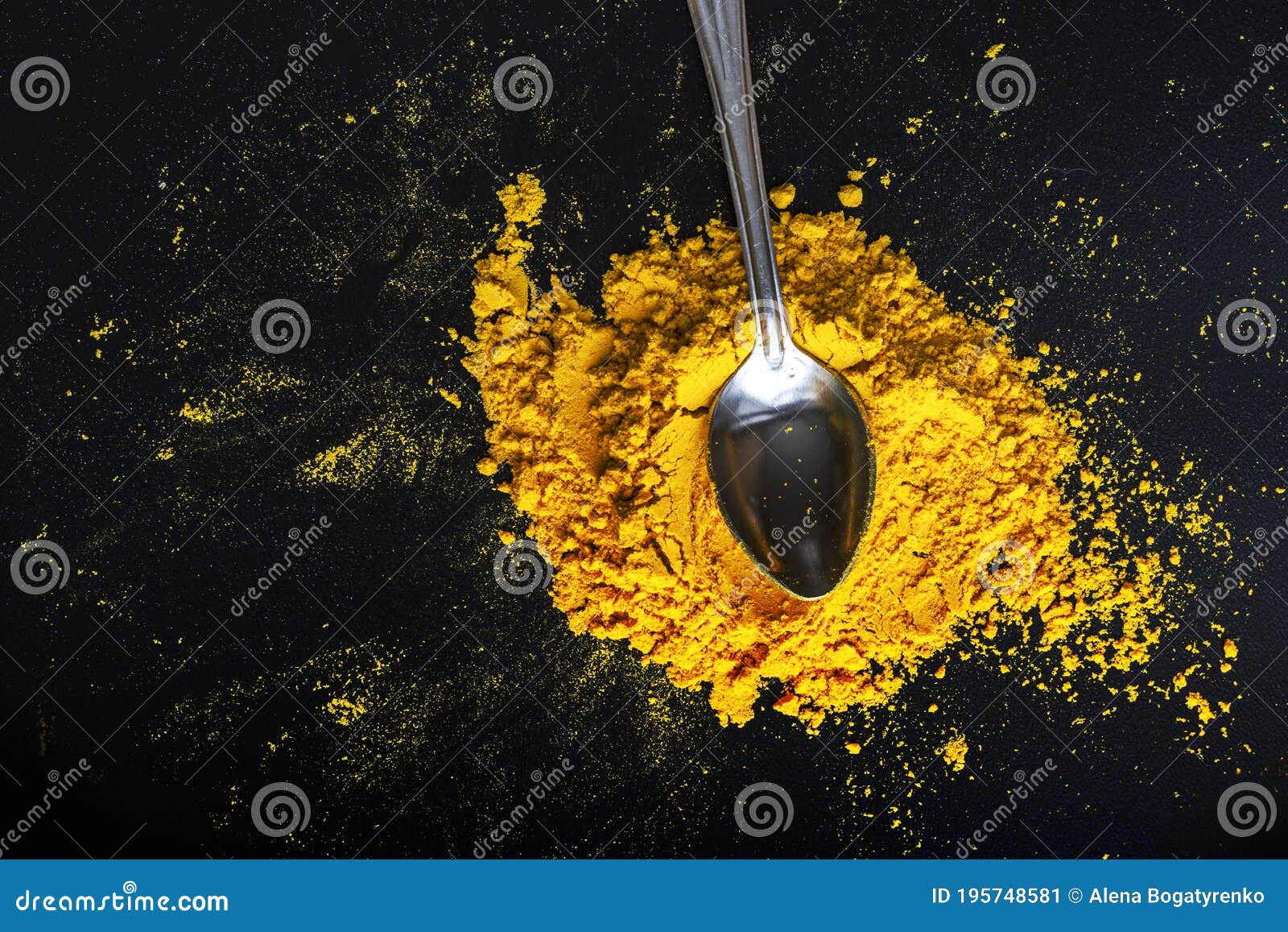 Bright Yellow Spice, Spilled Curry Powder with Spoon Stock Image