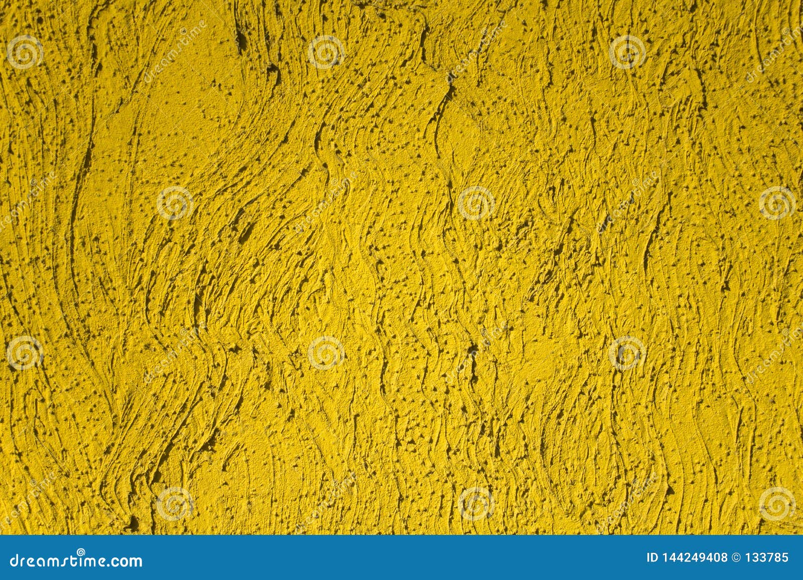 Bright Yellow Wall with Undulating Lines and Deep Relief with Shadows