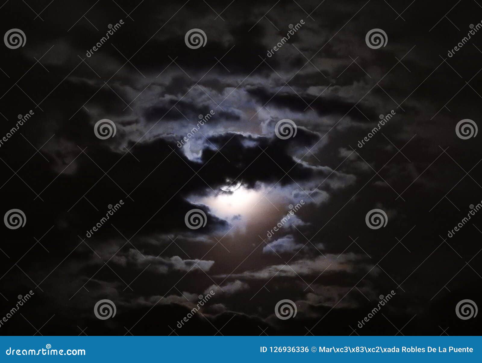 bright moon peeking out at night