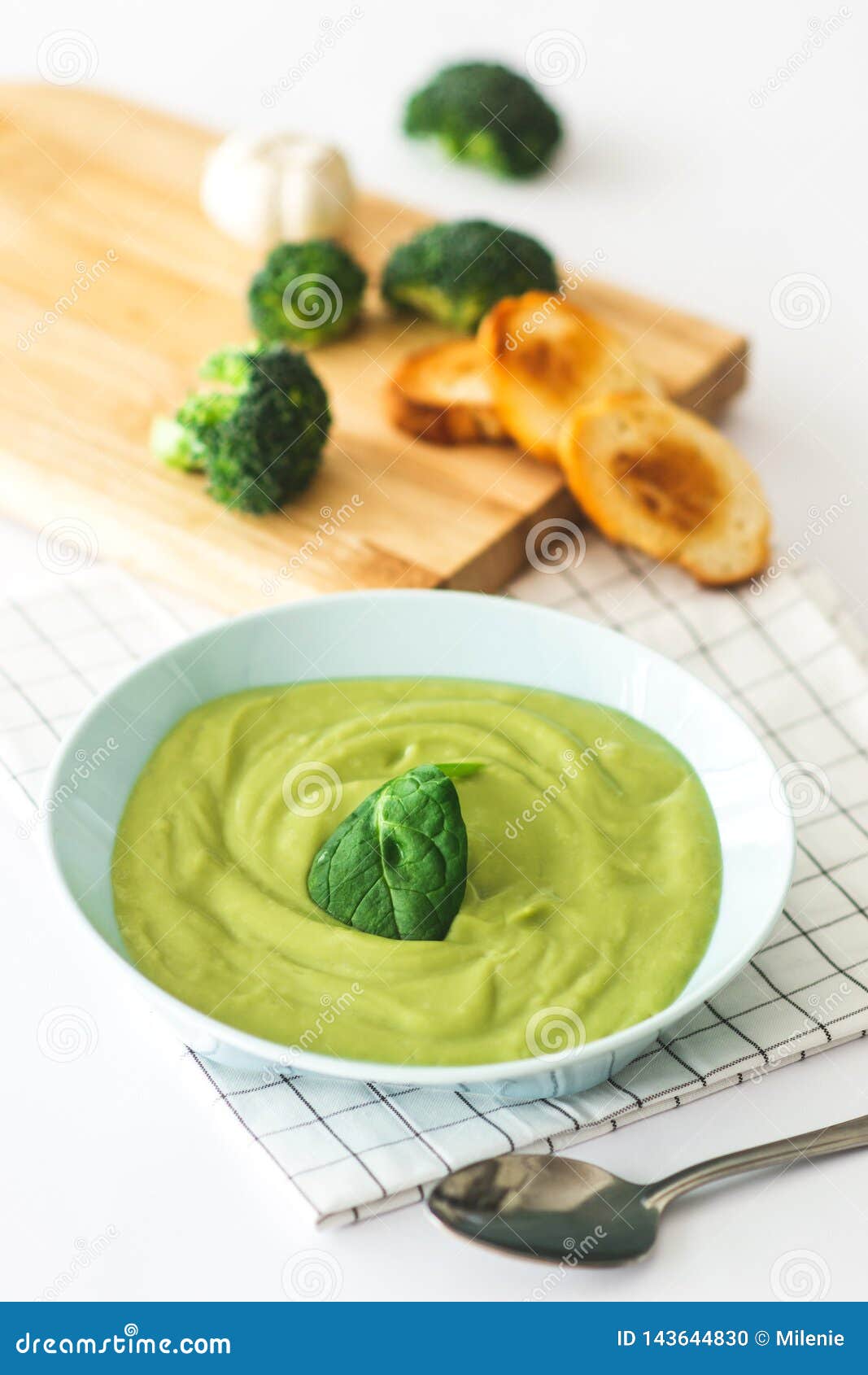 Broccoli Cream Soup in Pastel Blue Plate on White Background Stock ...