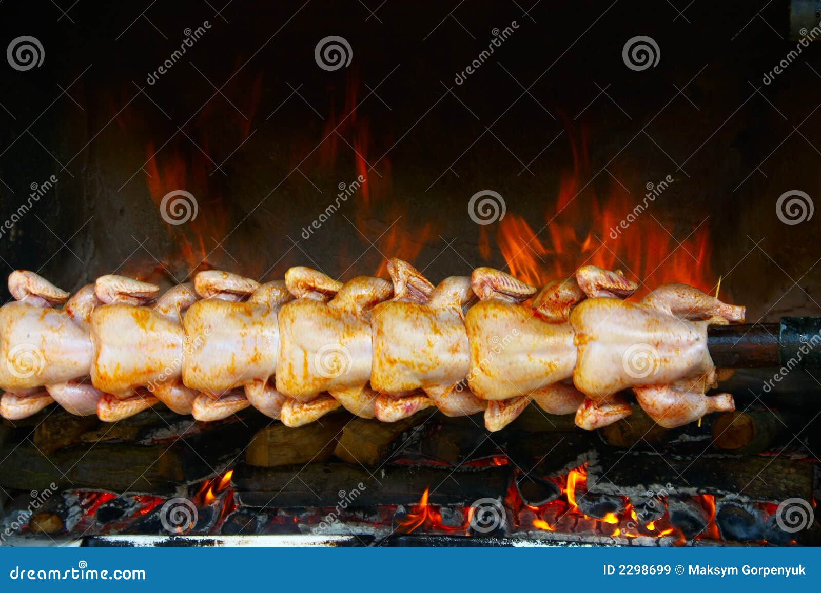 broiling chicken on spit