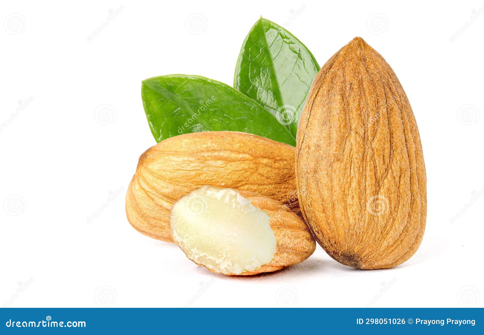 Broken Almonds and Good Almonds with Green Leaves. Stock Photo Image