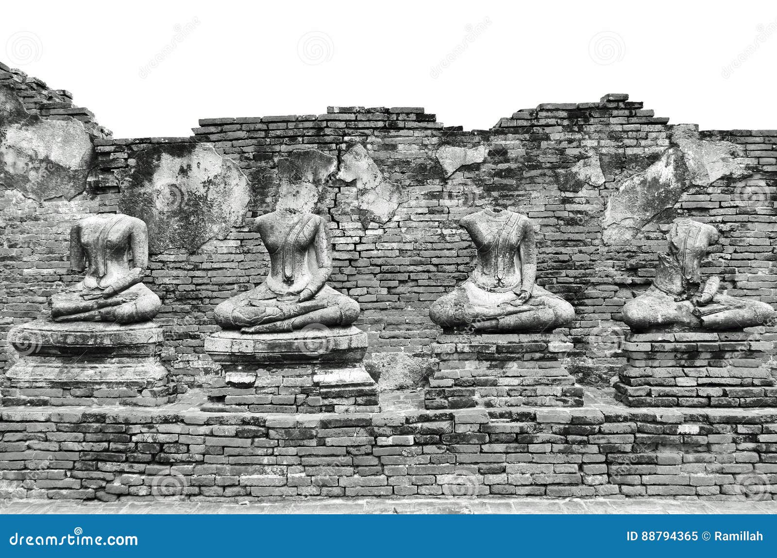 broken ancient buddha statues ruins at wat chaiwatthanaram in the historic city of ayutthaya, thailand in classic vintage black an
