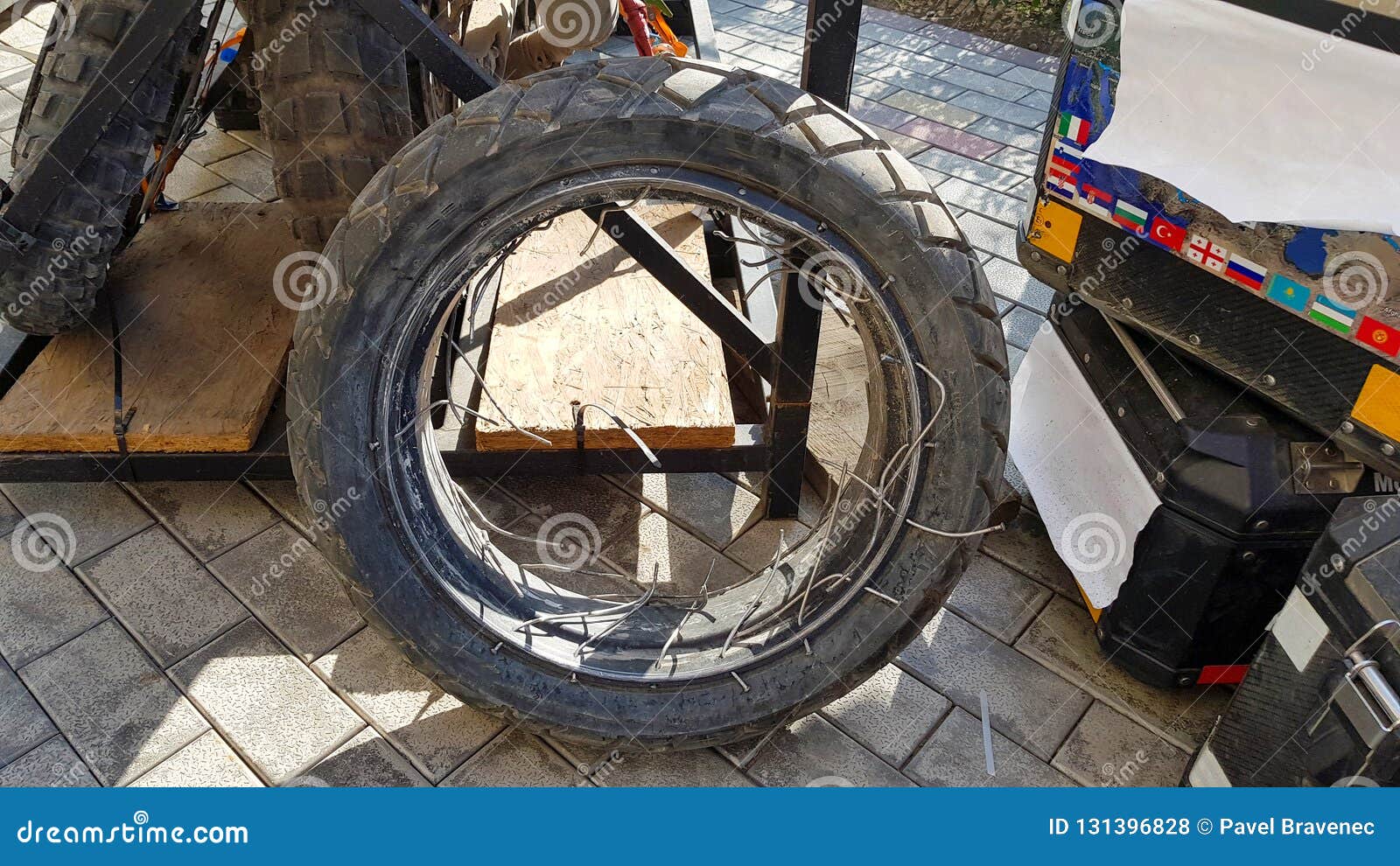 Broken Back Motorcycle Wheel with Broken Wire Spokes Stock Photo