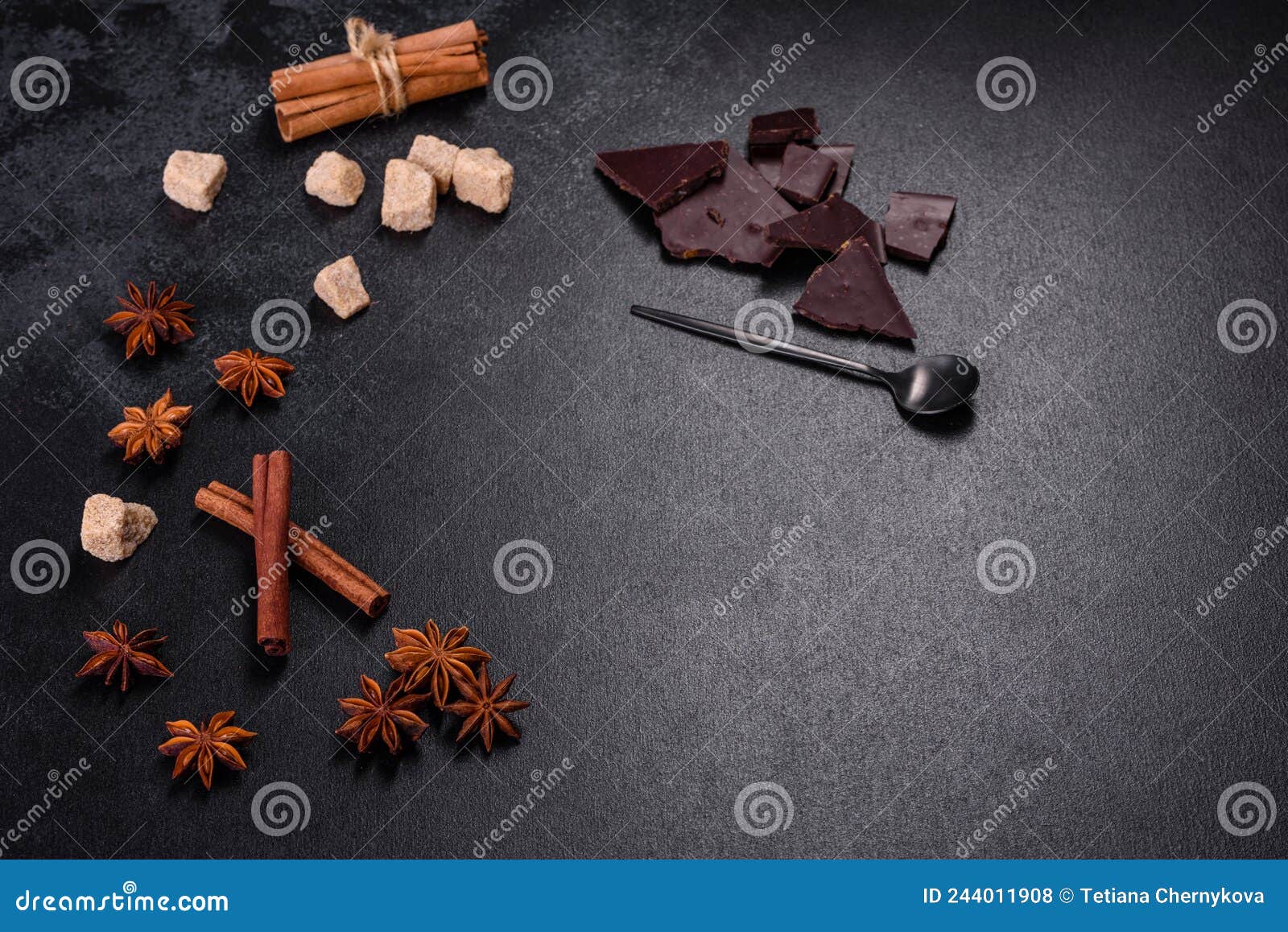 Broken Black Chocolate Pieces with Star Anise and Cinnamon Stock Photo