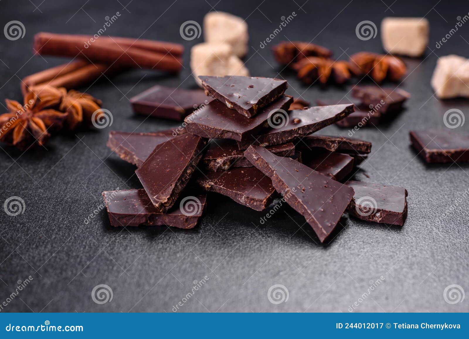 Broken Black Chocolate Pieces with Star Anise and Cinnamon Stock Image