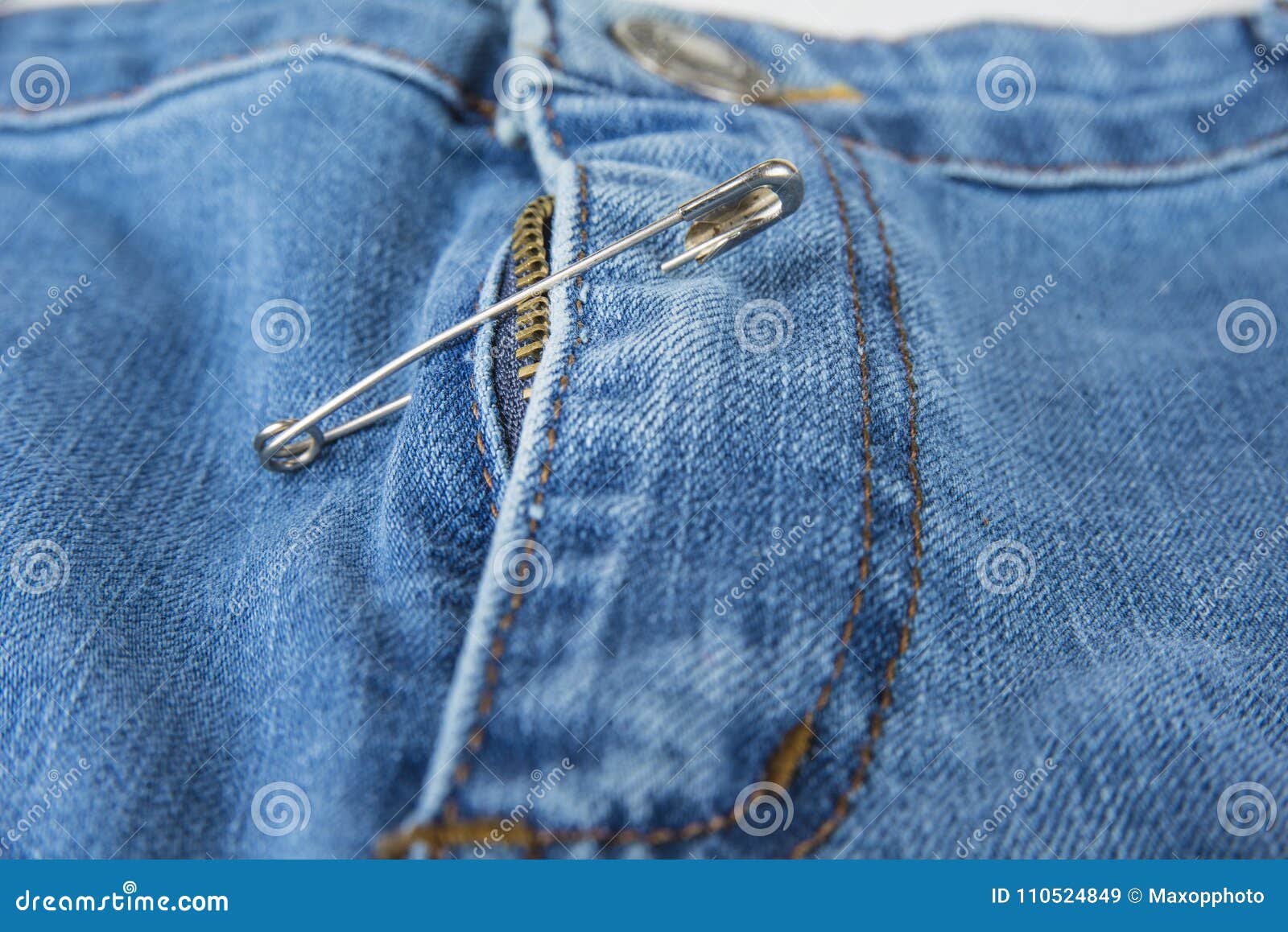 Broken Blue Jeans Zipper Fixed with Safety Pin. Stock Image Image of
