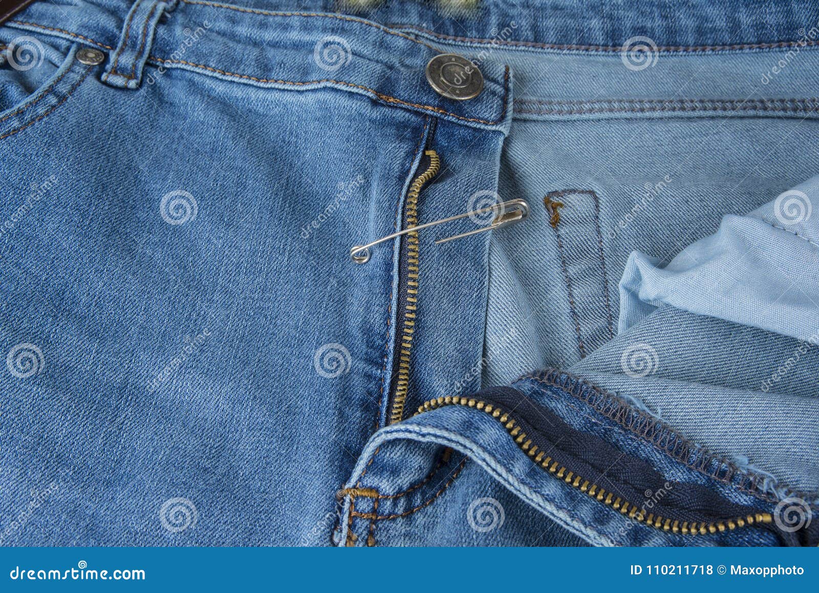 Broken Blue Jeans Zipper Fixed with Safety Pin. Stock Photo - Image of ...