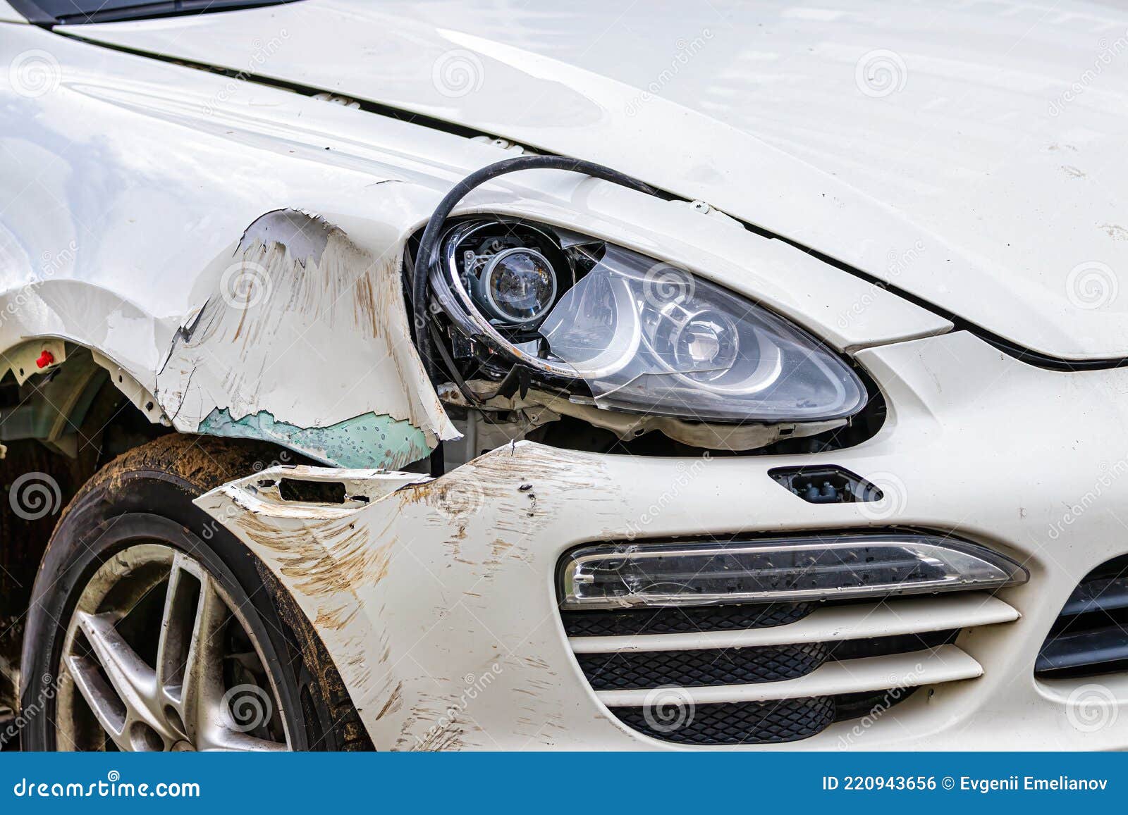 Broken Car after a Crash. Damaged Wing and Headlamp of a Car