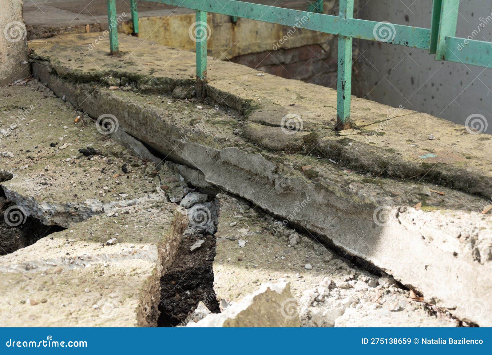 Broken Concrete Pavement. Broken Blind Area of an Apartment Building
