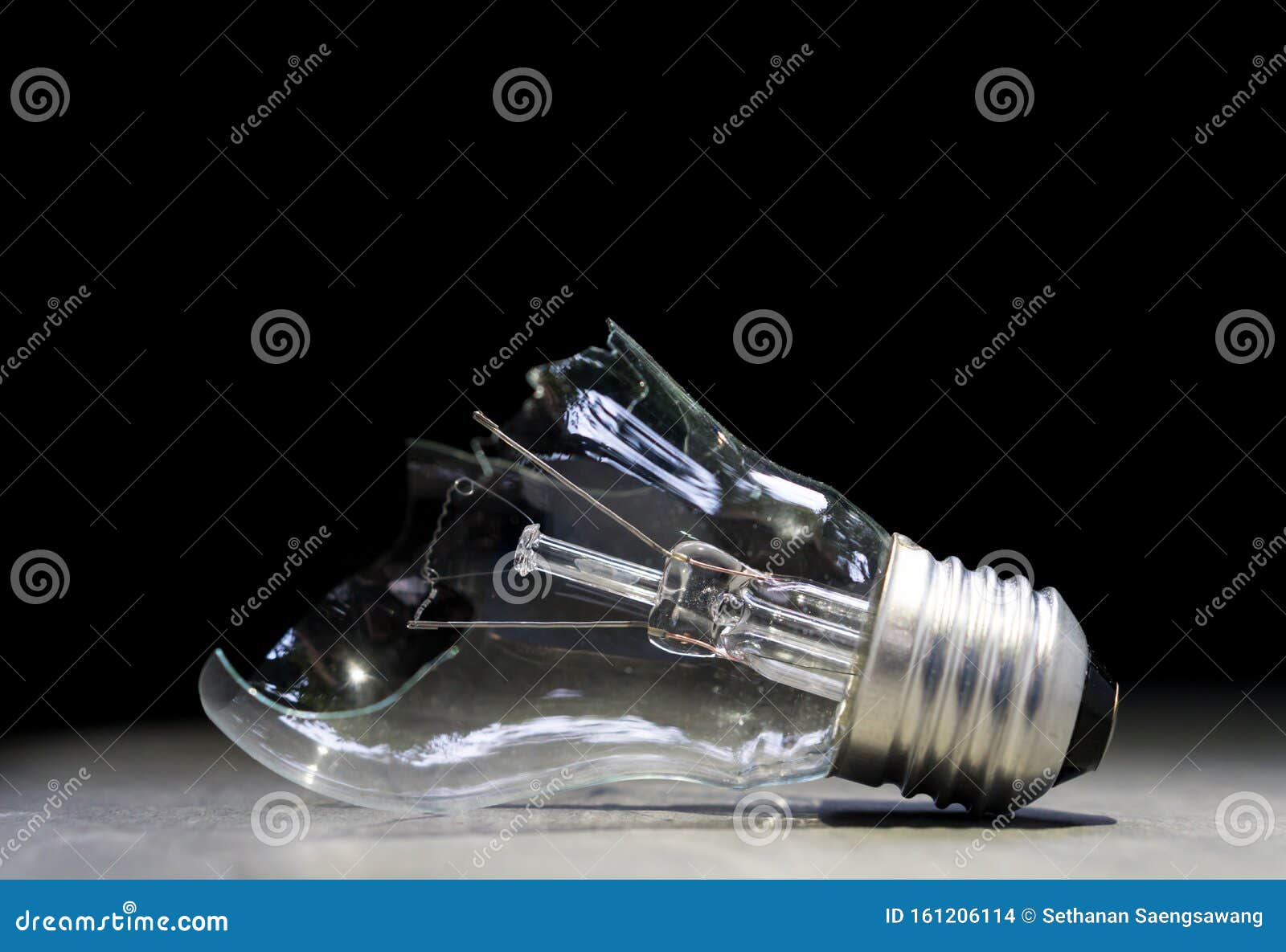 broken lightbulb on stone floor