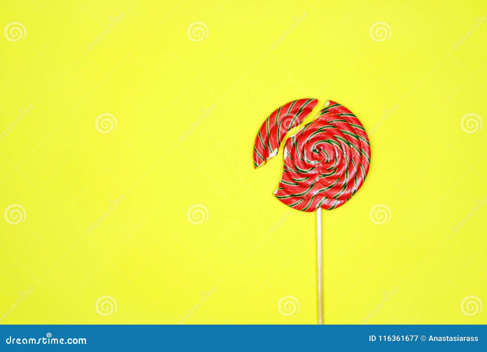 Broken Lollipop On Yellow Background Stock Image - Image of conceptual ...