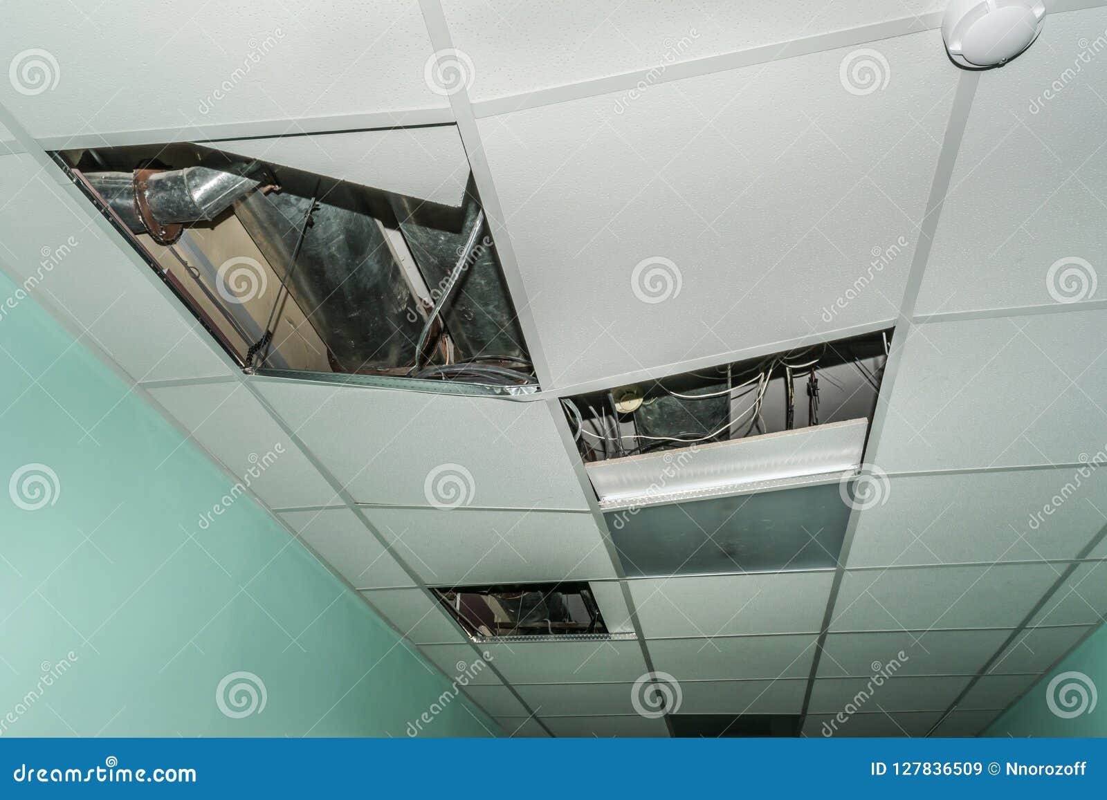 Broken Metal Rails Of A Modern False Ceiling In The Old