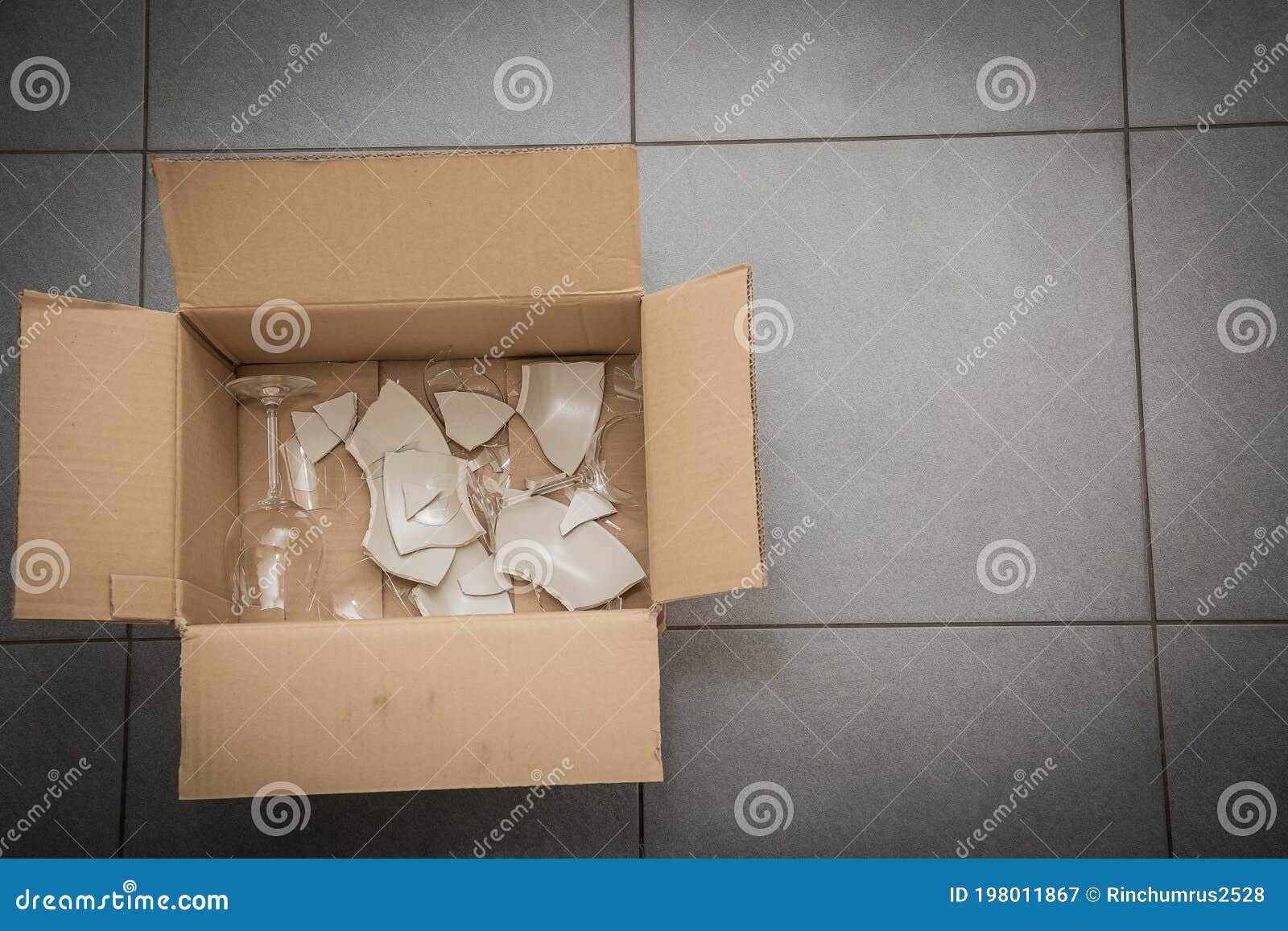 Broken Plates or Broken Glass Put in Box in the Kitchen. the Concept of