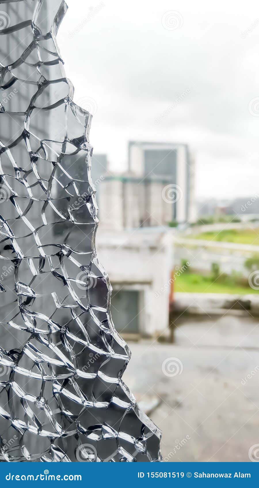 broken window glass closeup. view from broken window. shattered window glass. cracked window glass