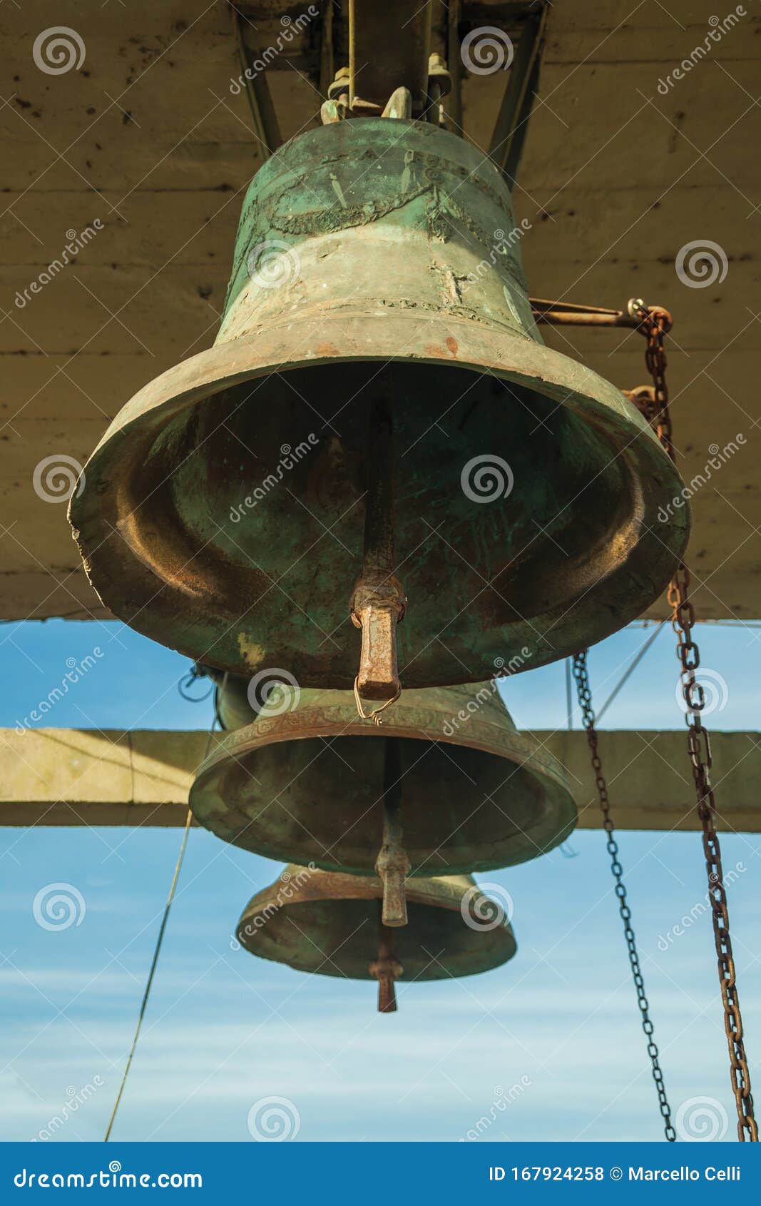 bronze bells with chain in a country church