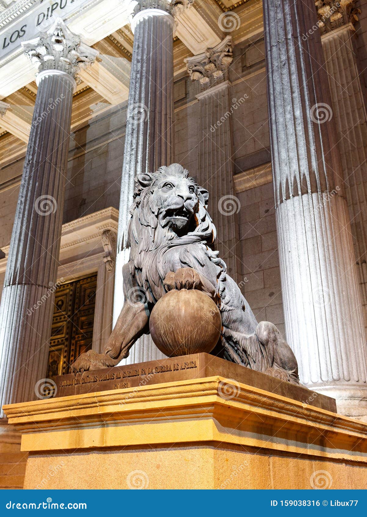 bronze lion statue at congreso de los deputados congress of deputies madrid spain at night