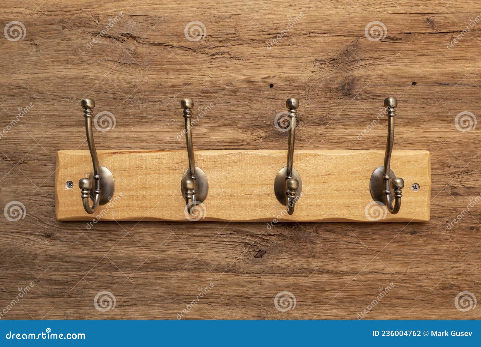 Bronze Metal Hooks for Hanging Clothes Attached To a Wooden Wall