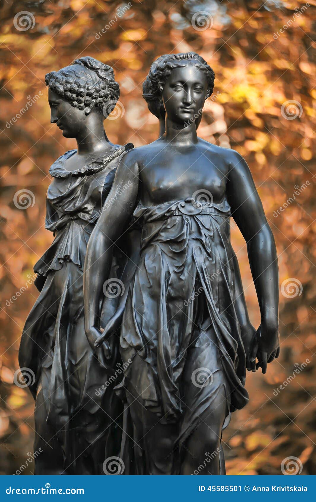a bronze sculpture of the three graces