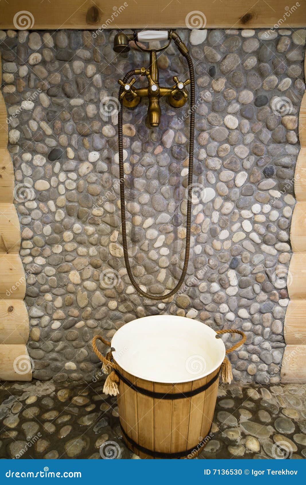 Outdoor shower and cold water bucket in a spa Stock Photo - Alamy