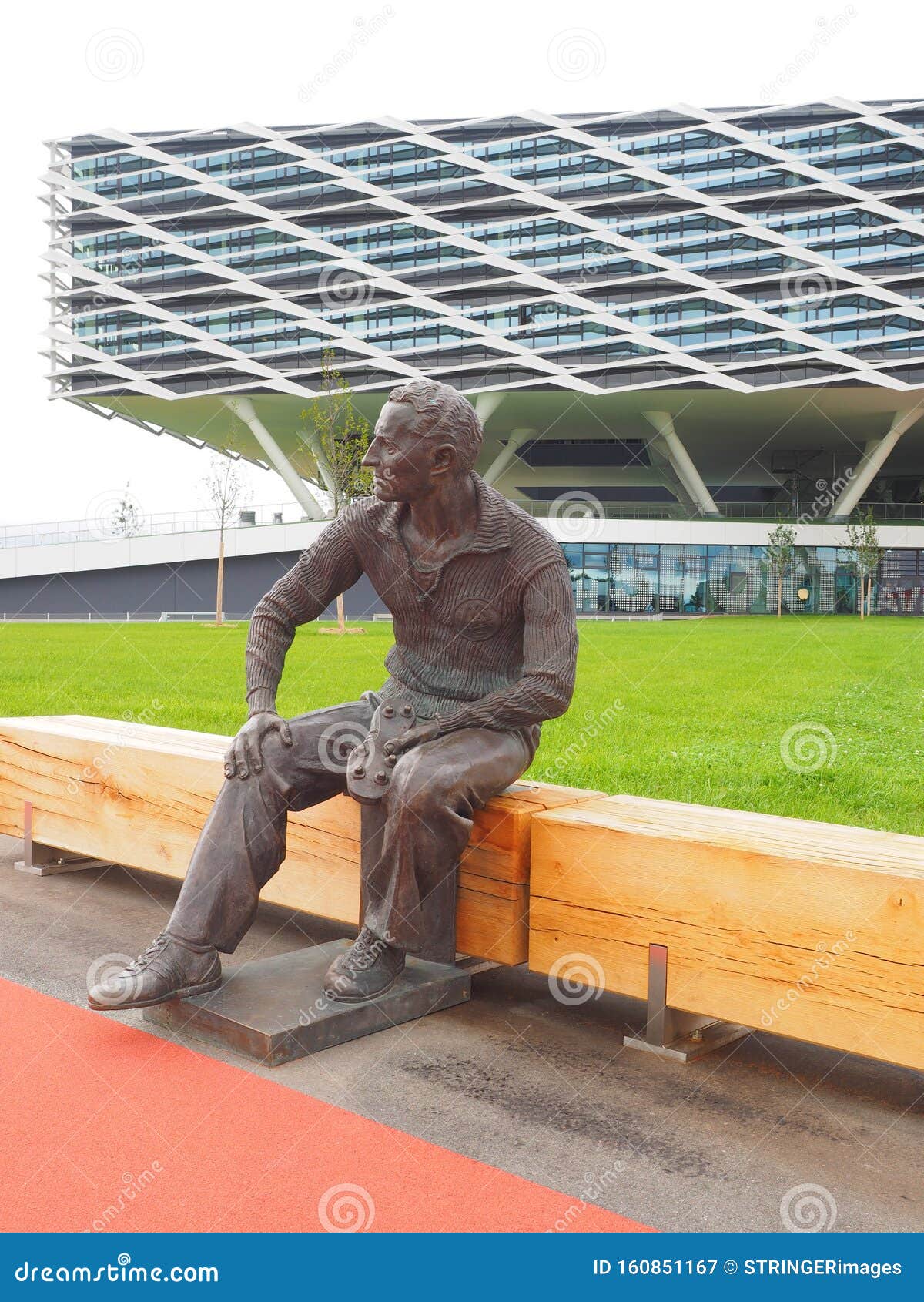Herzogenaurach, Germany - August 19, 2019: Bronze Statue of Company Founder Adi Dassler in Front of the New Adidas Headquarter in Editorial Photography of company, business: 160851167
