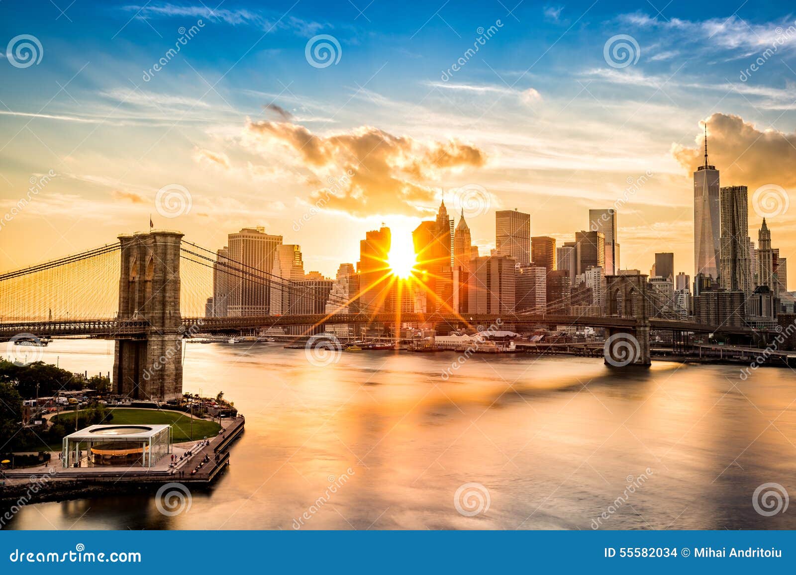 brooklyn bridge and the lower manhattan skyline at sunset