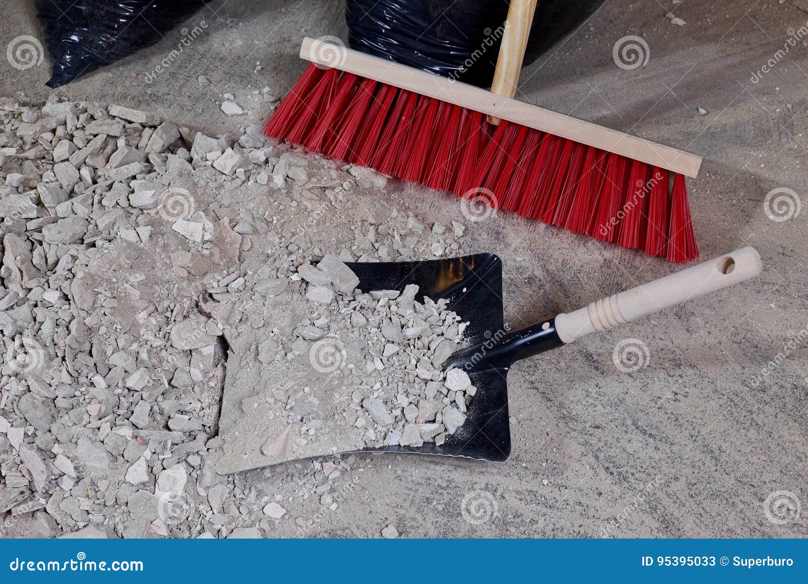 Broom and Dustpan on a Pile of Construction Rubble Stock Image Image