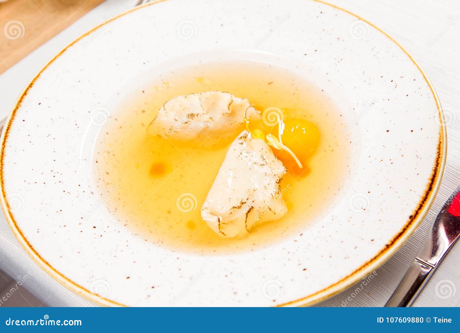 Broth with Dumplings and an Egg Yolk Stock Photo Image of entree, pour 107609880