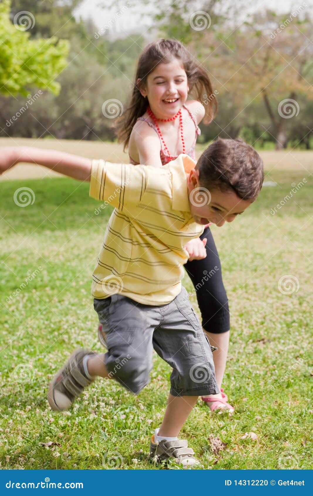 Brother Pulling His Sister Kids Toboggan Sled Snow. Little Girl And Boy