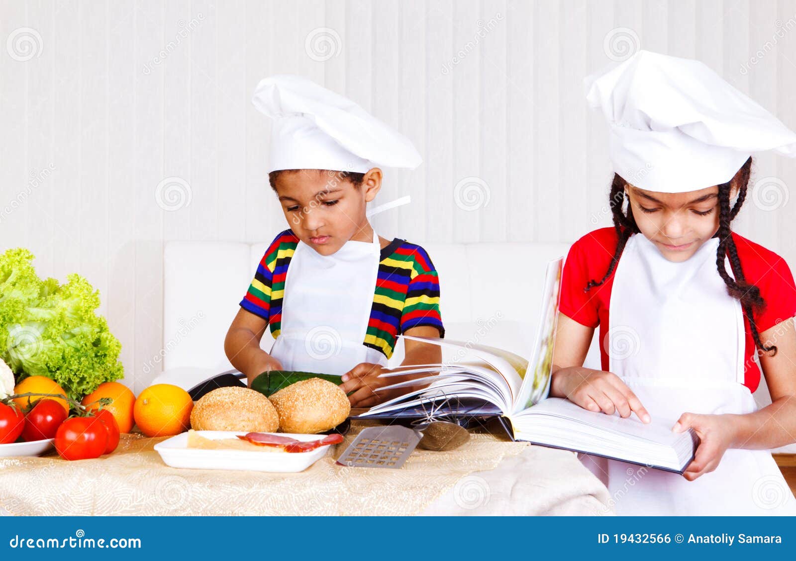 Brother and sister cooking stock photo. Image of cutting 19432566