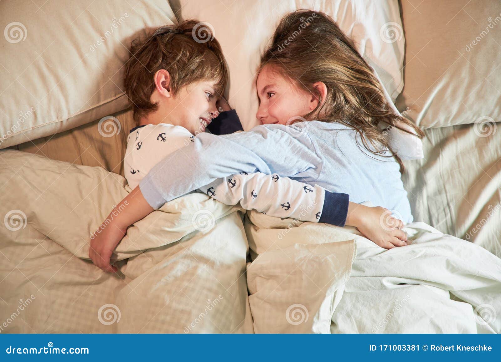 Brother and Sister Cuddle in Bed Stock Image - Image of bedroom ...