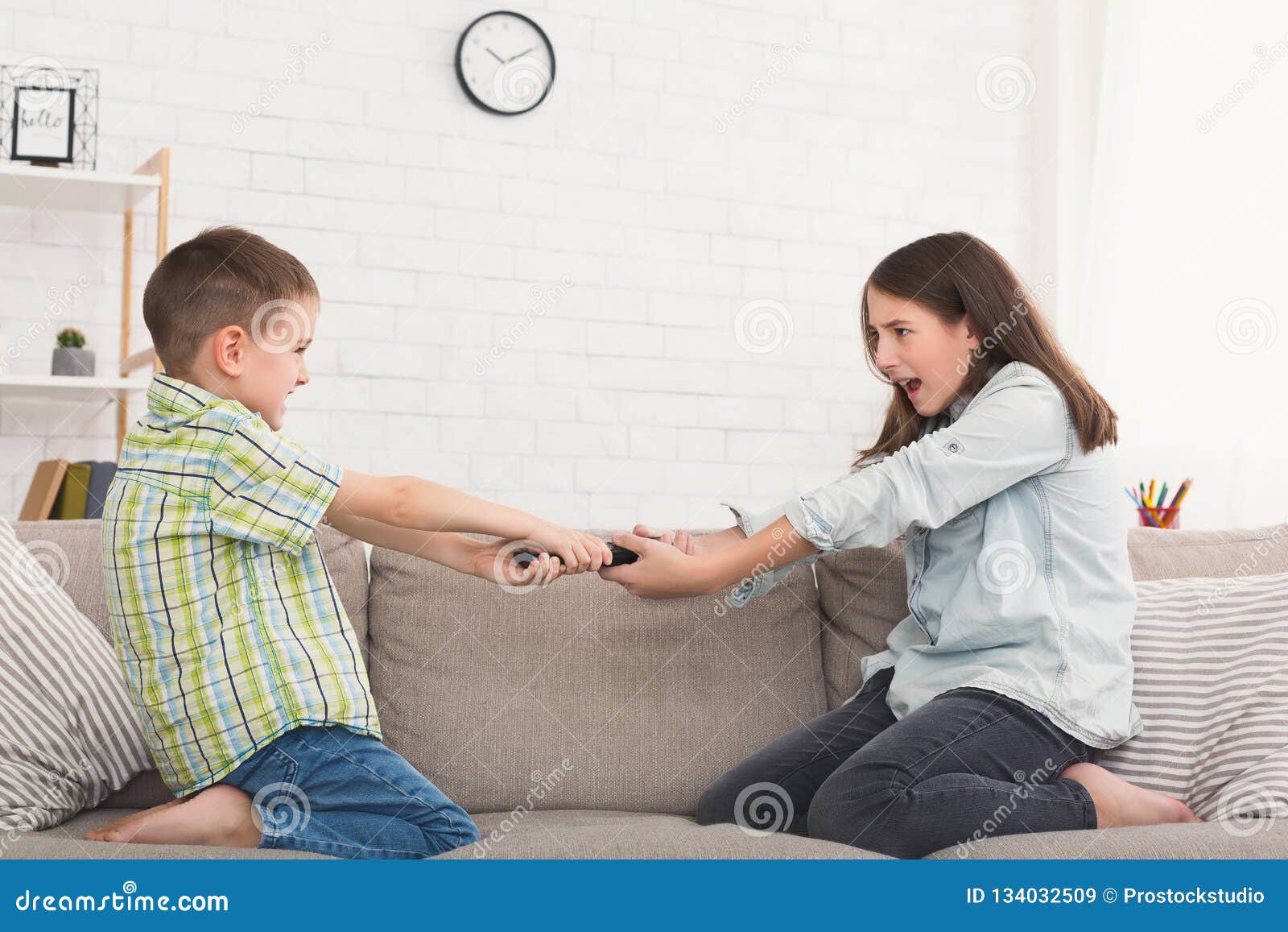 Brother and Sister Fighting Over Remote Control at Home Stock ...