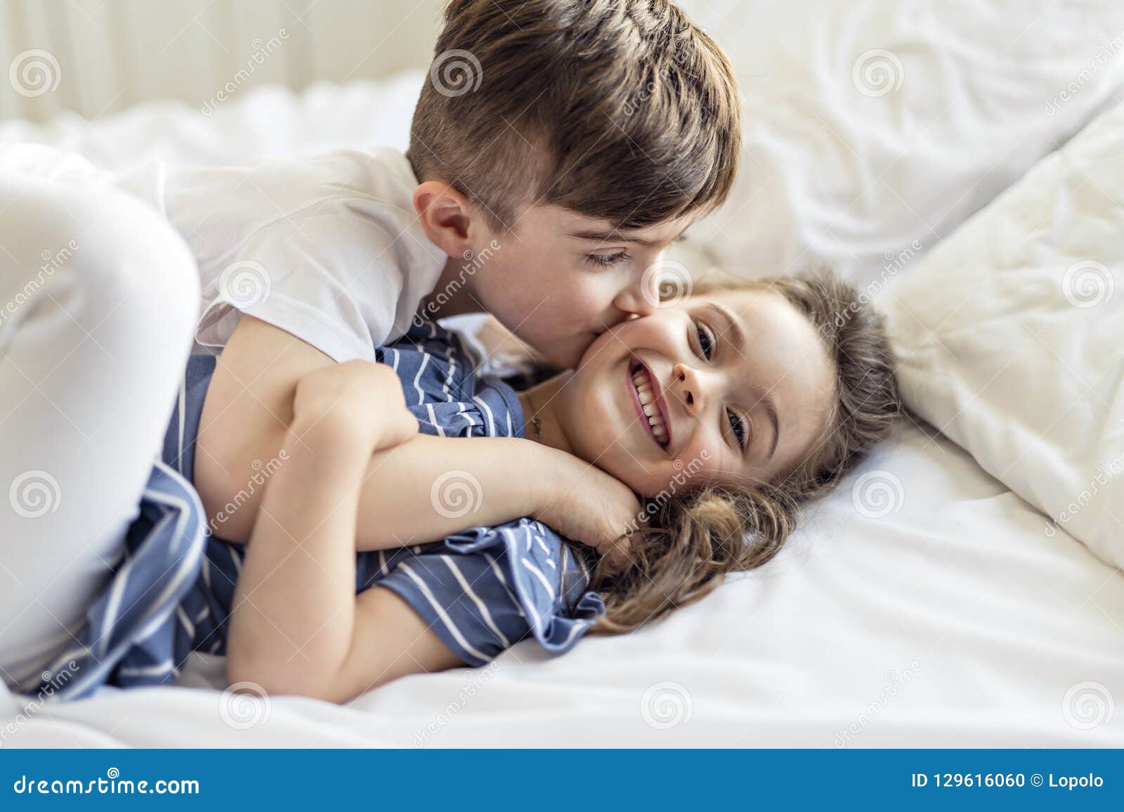 Brother and Sister Having Fun Together on Bed Stock Photo - Image ...