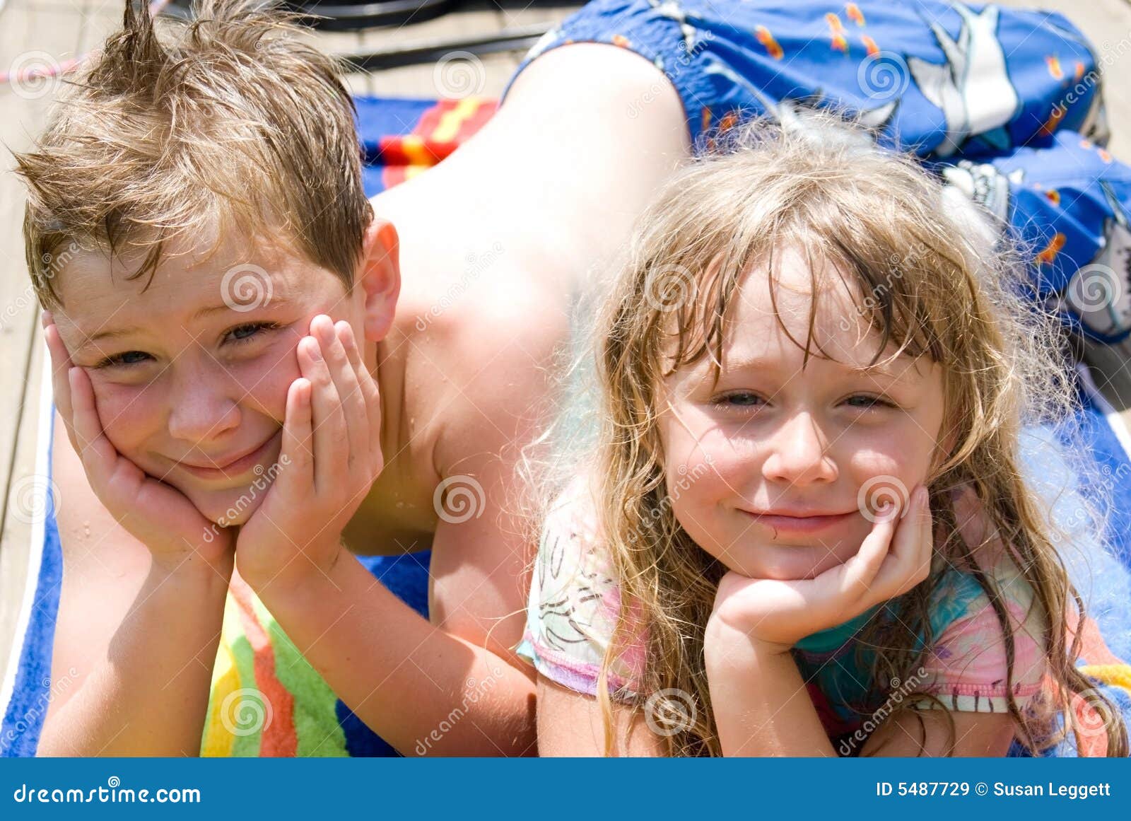 Brother and Sister after Swim Stock Image - Image of lying, active: 5487729