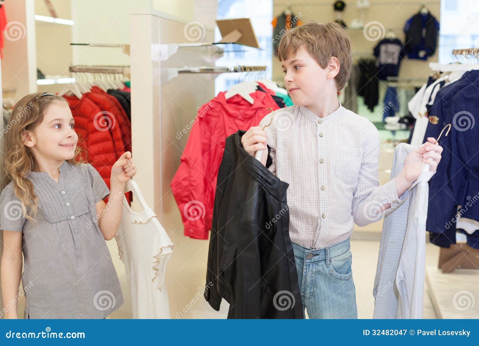 Brother with Sister Trying on Clothes in Store Stock Image - Image of ...