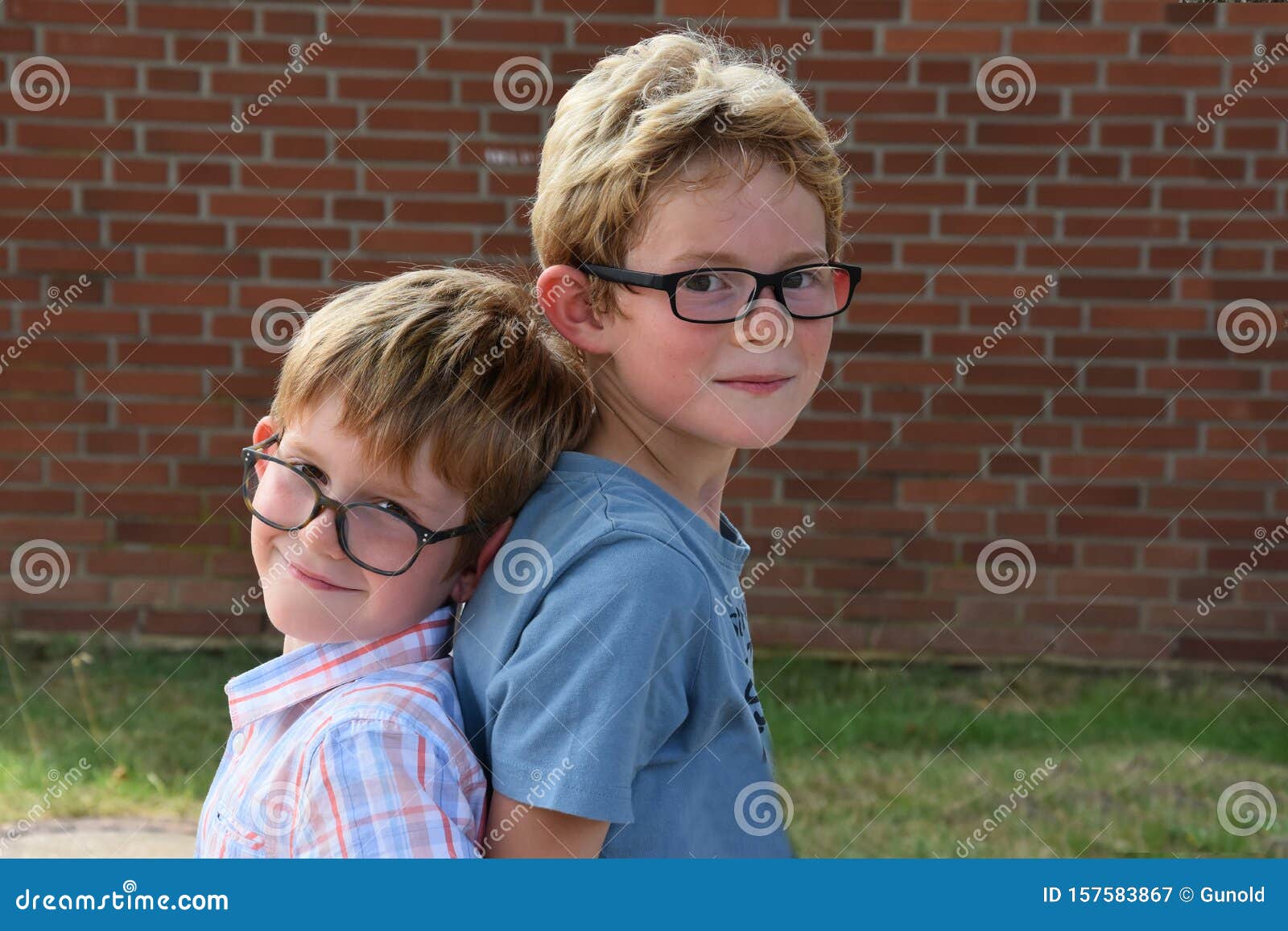 brothers, both with glasses playing together