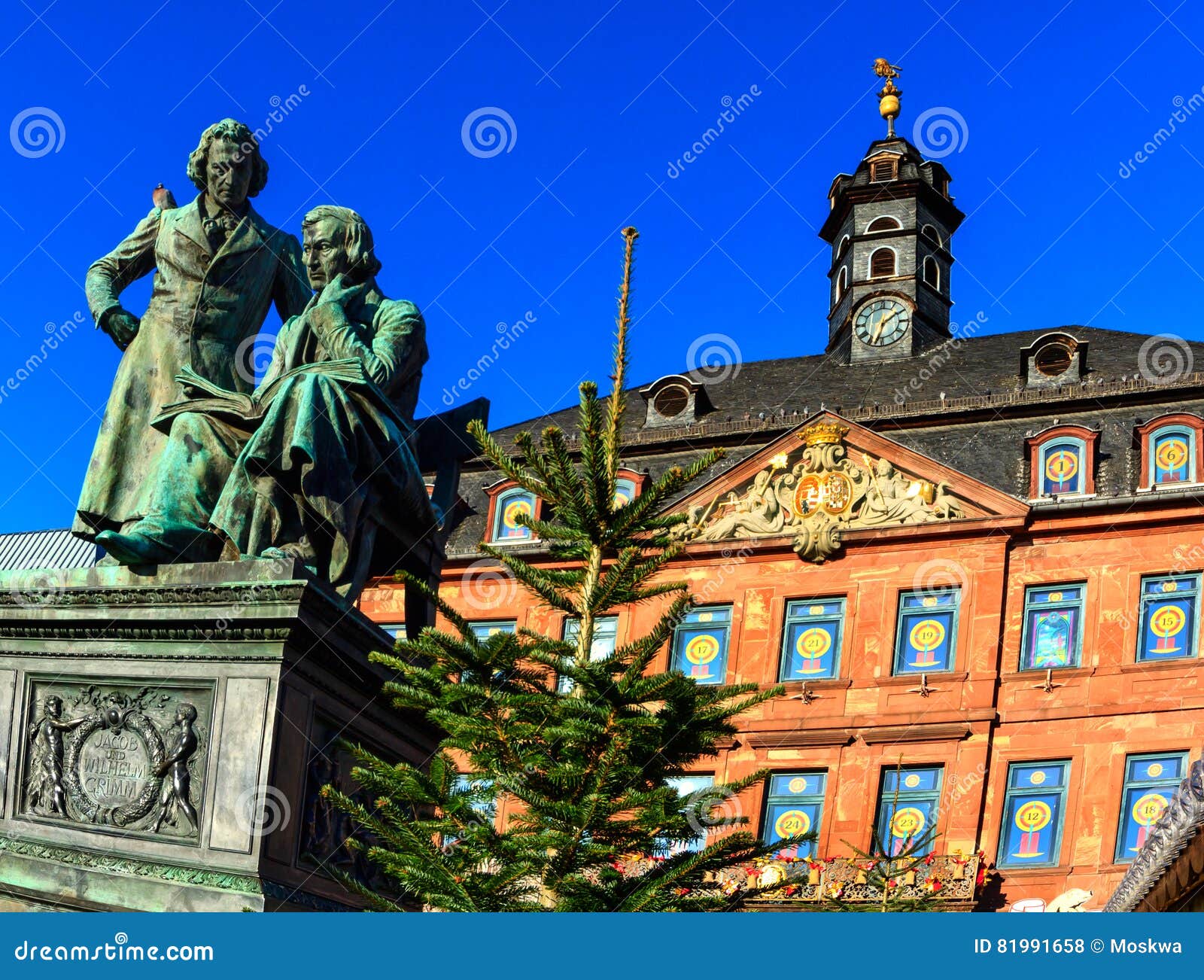 brothers grimm looking down at the christmas market in hanau, germany