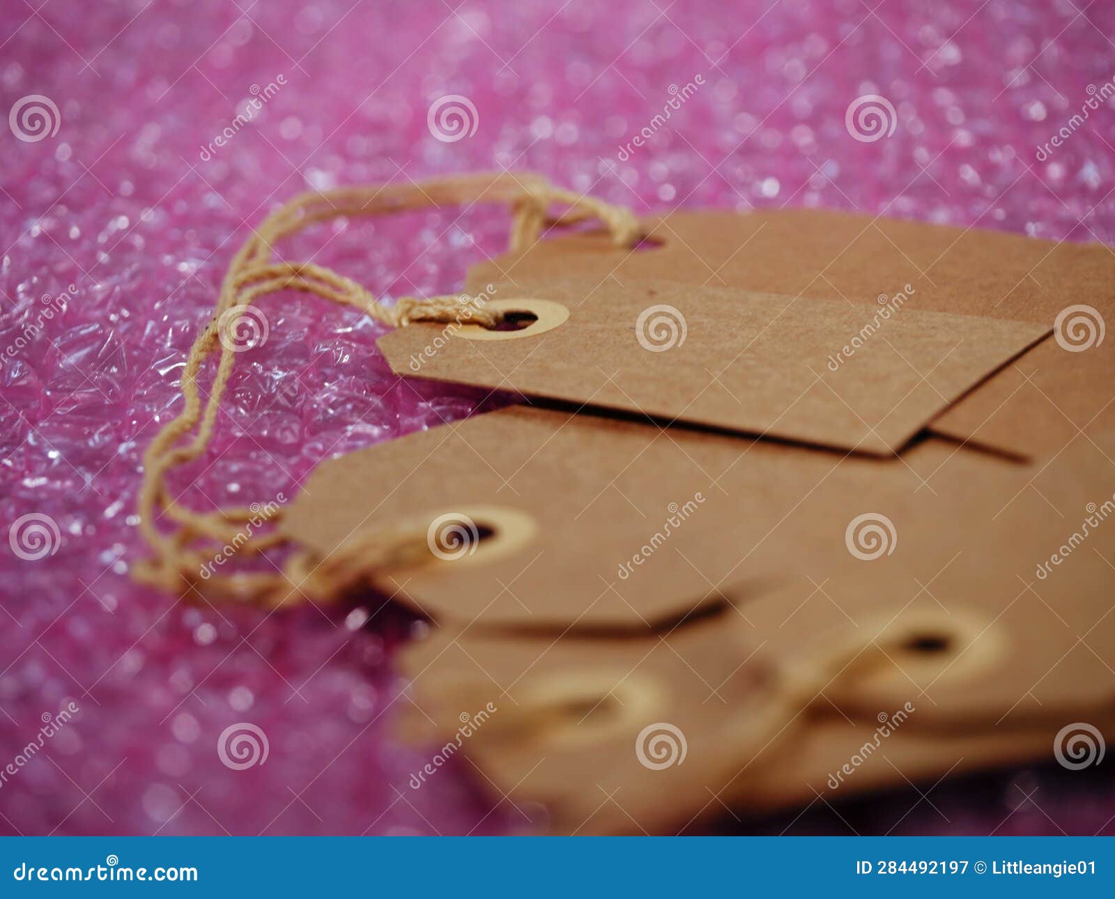 Brown Address Label Gift Tag and Bubble Wrap Background Medium Shot