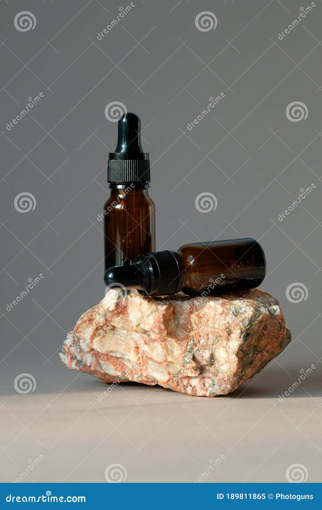 Download Brown Amber Glass Dropper Bottles Mockup On Stone. Natural ...