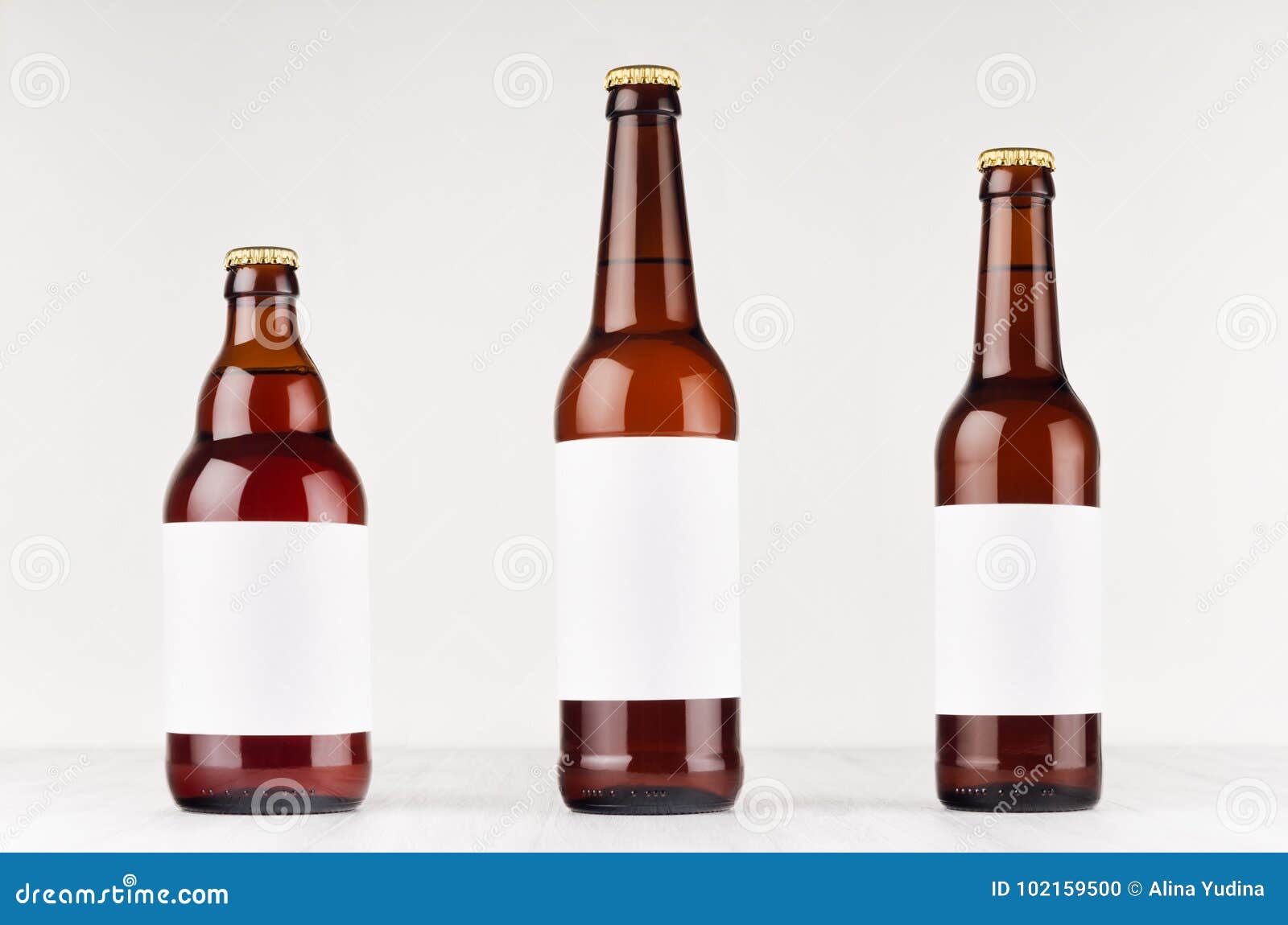 brown beer bottles collection different type with blank white label on white wooden board, mock up.