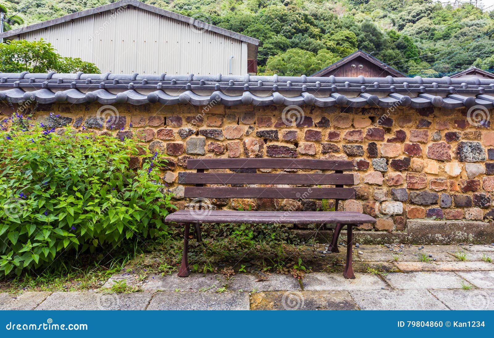 Brown Bench Against Retro Japanese Style Brick Wall Stock Photo Image