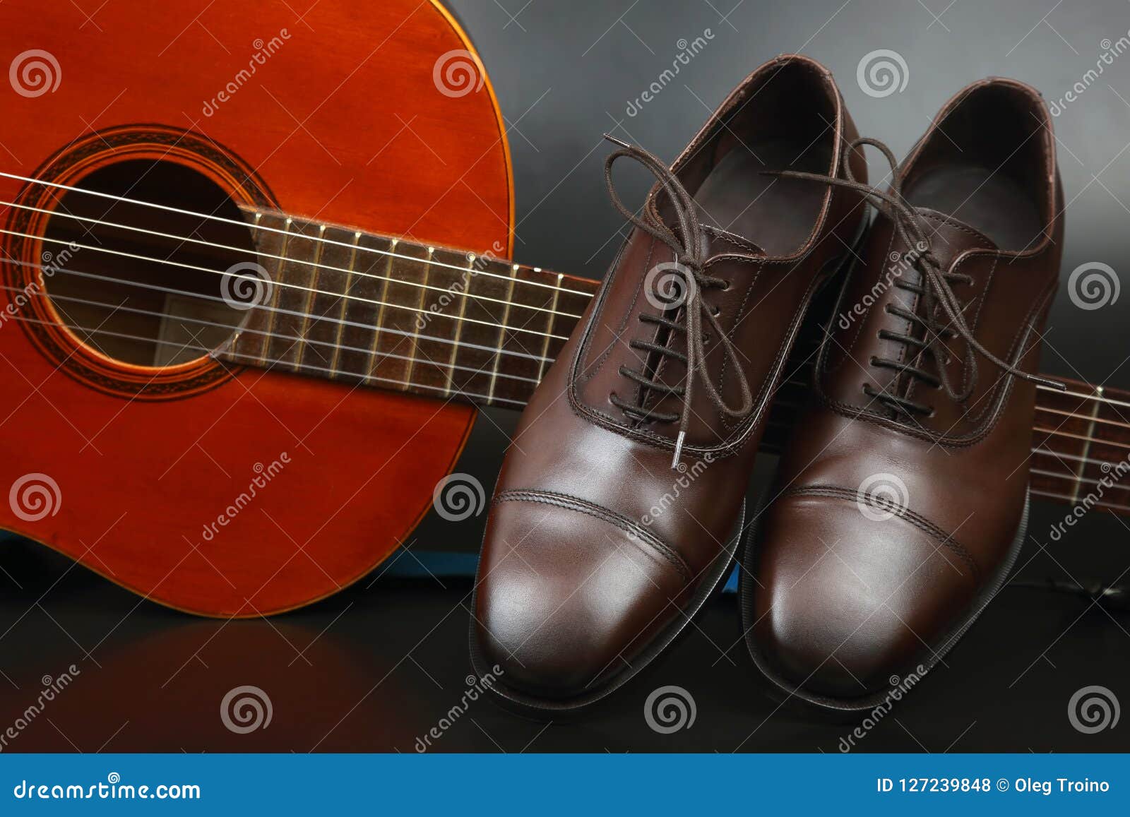 Brown Classic Men`s Shoes on Classical Guitar Background Stock Photo