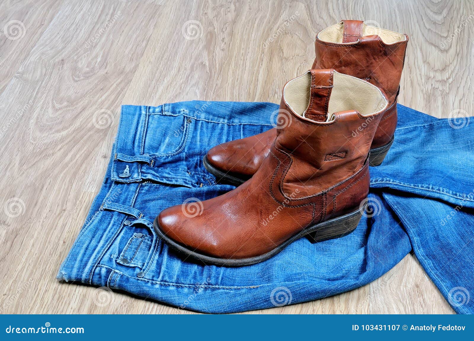 Brown Cowboy Boots on Blue Jeans Stock Image Image of boots, fashion 103431107