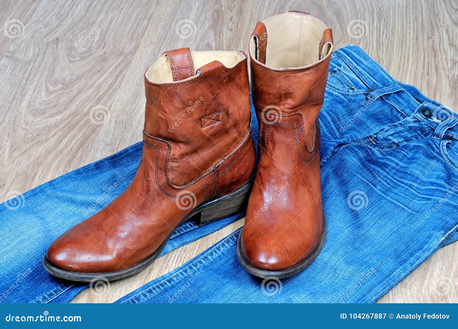 Brown Cowboy Boots on Blue Jeans Stock Image - Image of classic, design ...