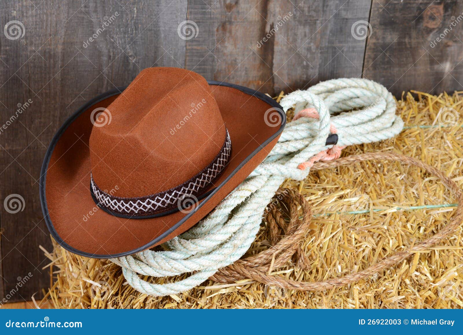 Brown cowboy hat on straw stock image. Image of closeup 26922003
