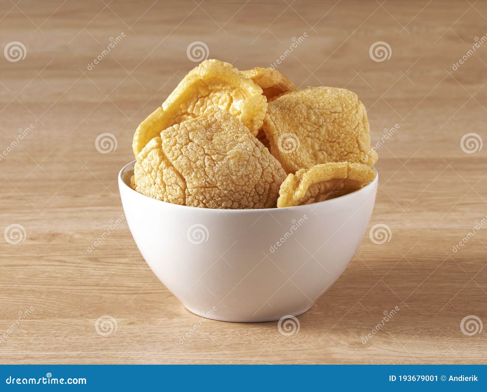 brown crackers served in a white bowl