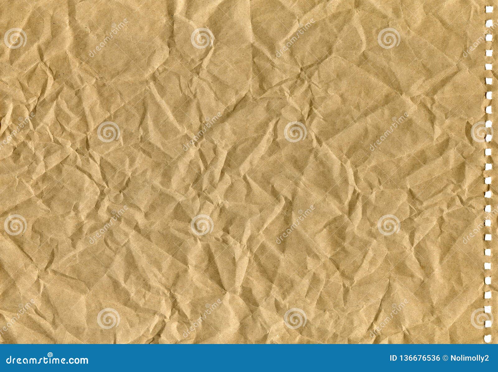 Brown Crumpled Old Kraft Paper with Perforation, Background Stock Photo